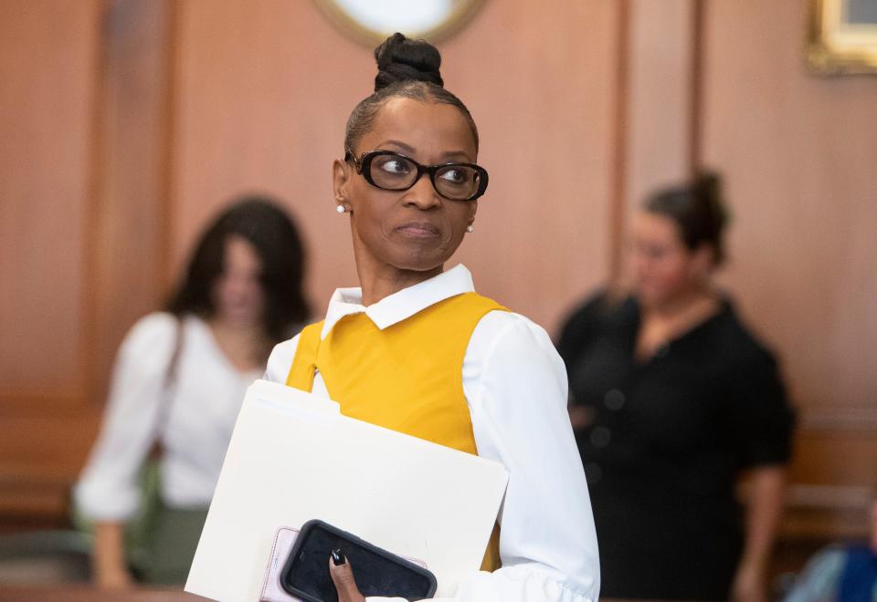 Shelby County Clerk Wanda Halbert stands up to speak to her attorneys after the first court appearance for Halbert’s ouster proceedings at Shelby County Circuit Court in Memphis, Tenn., on Friday, May 31, 2024.