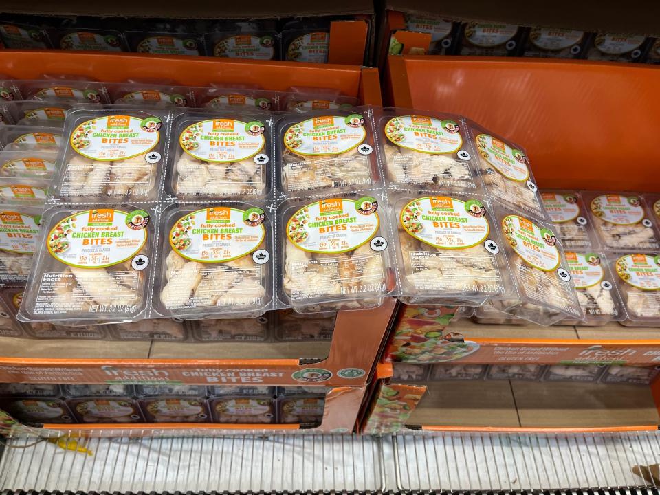 clear packs of individual chicken breasts in boxes at costco