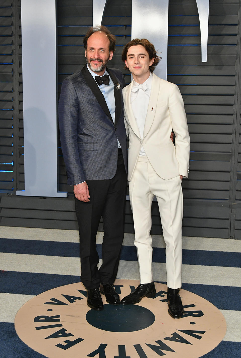 <p>Rocking a white Berluti tuxedo, Best Actor nominee Chalamat joined his <em>Call Me by Your Name</em> director for the <em>Vanity Fair</em> after-party. (Photo: Dia Dipasupil/Getty Images) </p>