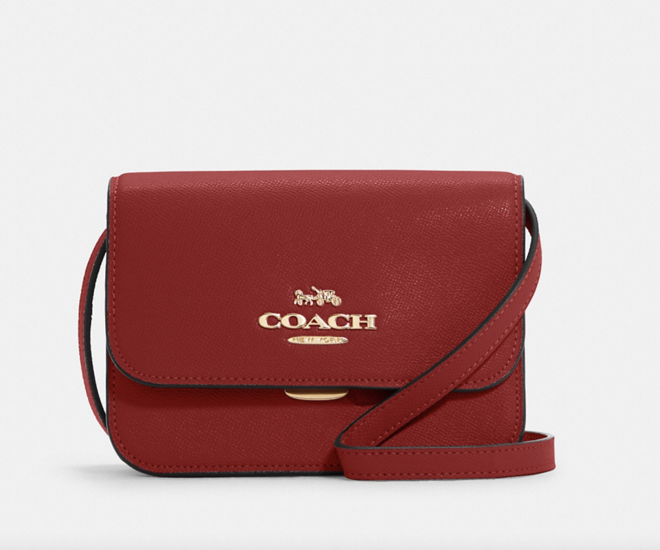 Mini Brynn Crossbody in red leather with gold coach lettering (Photo via Coach Outlet)