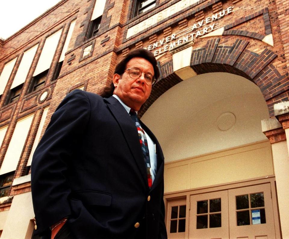 In this Dec. 3, 1998, photo, Rufino Mendoza Jr. stands before Denver Avenue Elementary School ahead of presenting a petition to the Fort Worth school district to rename the campus after his father, Rufino Mendoza Sr. Bobby Ornelas/STAR-TELEGRAM