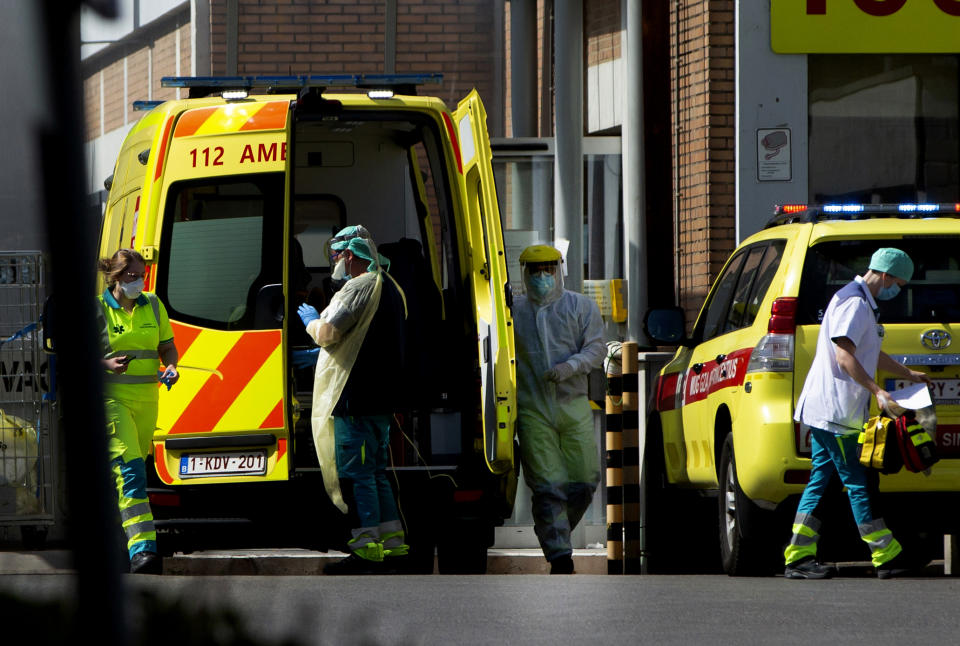 FILE - In this Monday, April 13, 2020 file photo, medical personnel in protective gear prepare to receive a patient at a hospital in Antwerp, Belgium. This week news struck that the European Center for Disease Control has put Belgium at the largest number of COVID-19 cases per 100,000 citizens, surpassing the Czech Republic, it is revealed Tuesday Oct. 27, 2020. (AP Photo/Virginia Mayo, File)