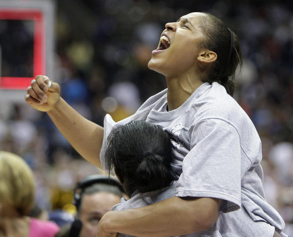 Connecticut's Maya Moore celebrates following the women's NCAA Final Four college basketball championship game against Stanford, April 6, 2010, in San Antonio. Moore has officially decided to retire from playing basketball, making her announcement on “Good Morning America” on Monday, Jan. 16, 2023. (AP Photo/Sue Ogrocki)