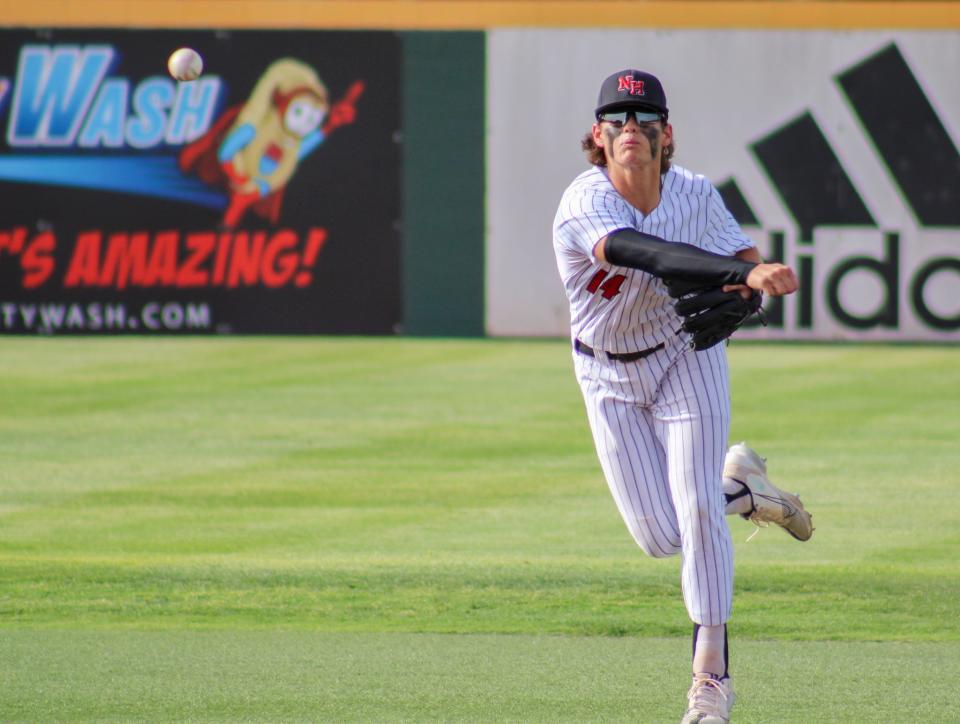 New Home's Logan Addison throws to first for the out during their Region I-2A quarterfinal baseball series at Hays Field at Lubbock Christian University on Friday, May 20, 2022.