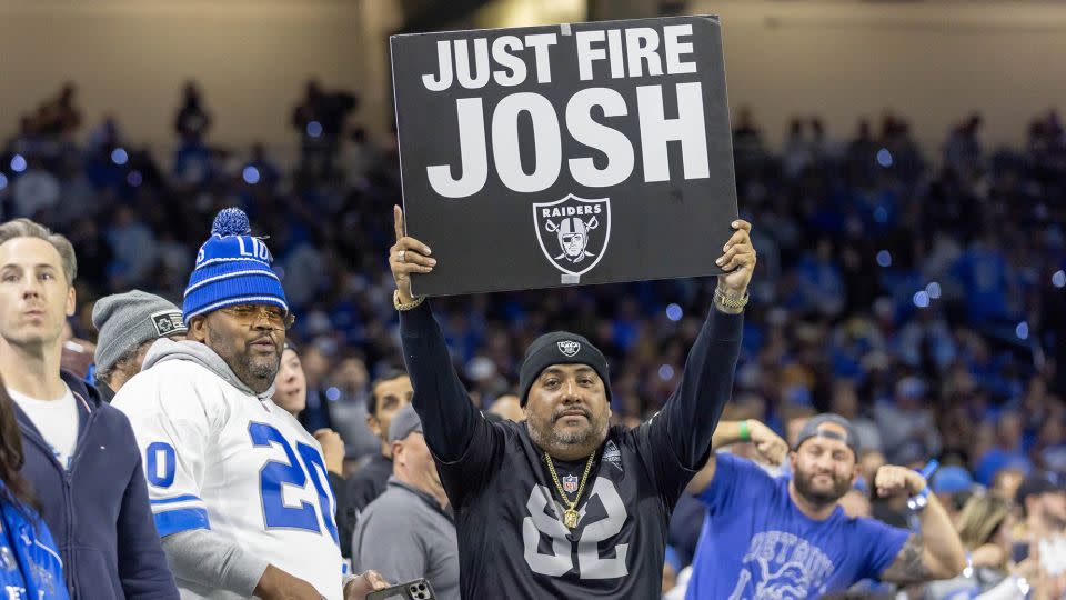 An unhappy Raiders fan holds up a sign calling for McDaniels' firing during the first half of the game against the Lions on Monday night. - David Reginek/USA TODAY Sports/Reuters