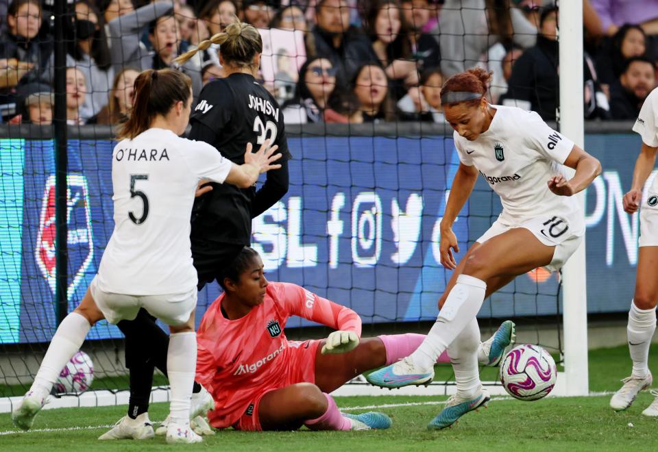 Mar 26, 2023; Los Angeles, California, USA; New Jersey/New York Gotham FC forward 
Lynn Williams (10) clears the ball away against Angel City FC midfielder Alyssa Thompson (21) during the first half at BMO Stadium.