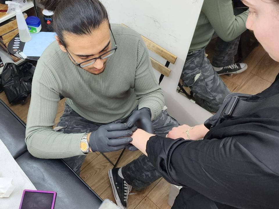 The author getting tattooed in Jerusalem.