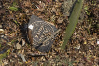 A pizza box is mixed-in with other compostable items awaiting composting at the Anaerobic Composter Facility in Woodland, Calif., Tuesday, Nov. 30, 2021. In January 2022, new rules take effect in California requiring people to recycle organic waste like food and cardboard boxes so they can be turned into compost or energy. The goal is to reduce greenhouse gas emissions from landfills. (AP Photo/Rich Pedroncelli)