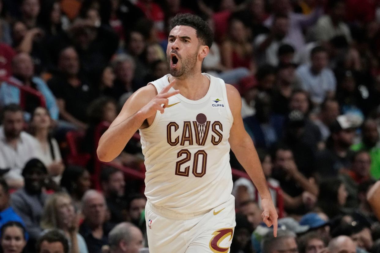 Cleveland Cavaliers forward Georges Niang (20) gestures after scoring during the second half of an NBA basketball game against the Miami Heat, Friday, Dec. 8, 2023, in Miami. (AP Photo/Marta Lavandier)