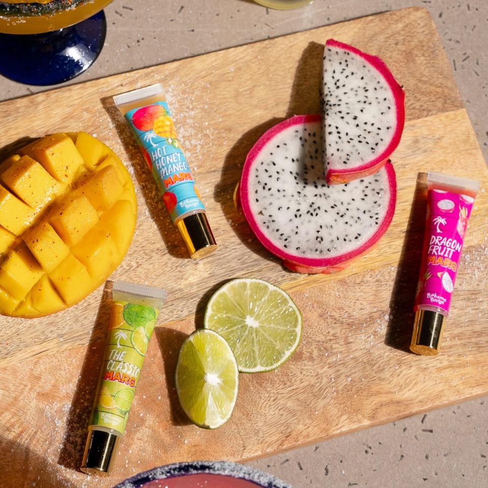 Bahama Breeze Island Grille is selling limited-edition lip glosses with flavors including Classic Marg, Dragon Fruit Margarita, and Hot Honey Mango Margarita, available for $10 each starting Thursday on the Mizzi Cosmetics website (while supplies last).