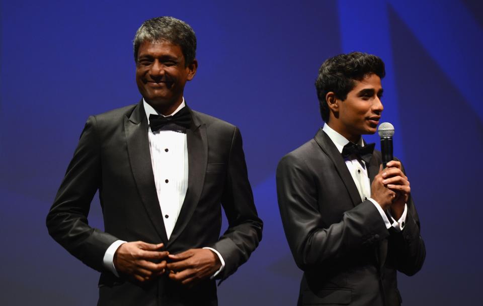 DUBAI, UNITED ARAB EMIRATES - DECEMBER 09: Actor Adil Hussain and Suraj Sharma on stage ahead of the "Life of PI" Opening Gala during day one of the 9th Annual Dubai International Film Festival held at the Madinat Jumeriah Complex on December 9, 2012 in Dubai, United Arab Emirates. (Photo by Andrew H. Walker/Getty Images for DIFF)