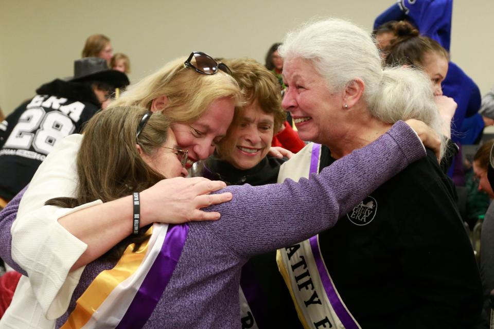 Supporters of the Equal Rights Amendment react to the Senate Privileges and Elections committee vote to report the ERA amendment the floor of the Senate during a Committee hearing at the Virginia State Capitol in Richmond, Va., Thursday, Jan. 9, 2020.