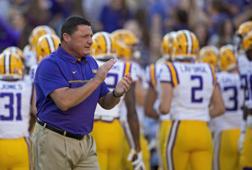 LSU interim head coach Ed Orgeron greets his players as they enter Tiger Stadium before an NCAA college football game against Missouri in Baton Rouge, La., Saturday, Oct. 1, 2016. (AP Photo/Max Becherer)