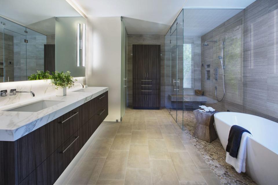 <p>A master bath from <a href="https://deringhall.com/interior-designers/cecilie-starin-design" rel="nofollow noopener" target="_blank" data-ylk="slk:Cecilie Starin Design;elm:context_link;itc:0" class="link ">Cecilie Starin Design</a> is minimalist and spacious.</p>