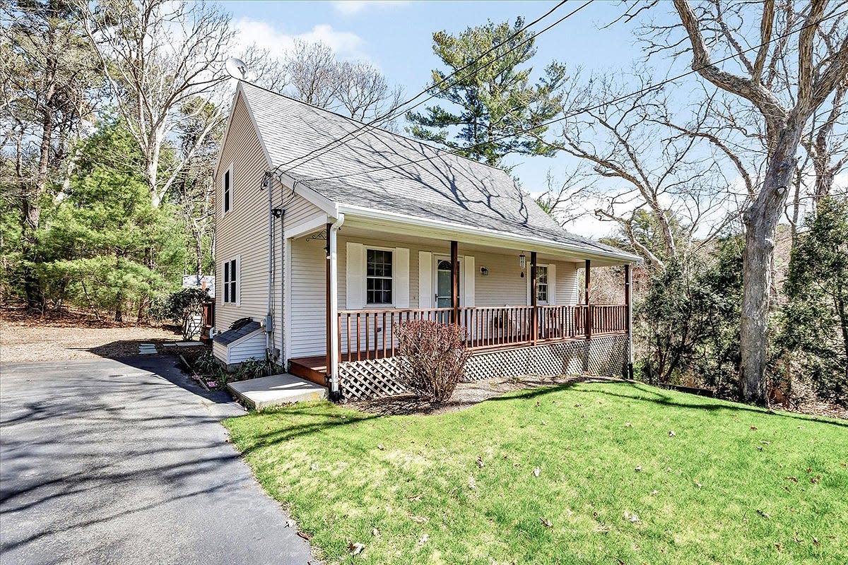 This Mashpee home, priced at $549K, features an open design first floor and two full bathrooms.