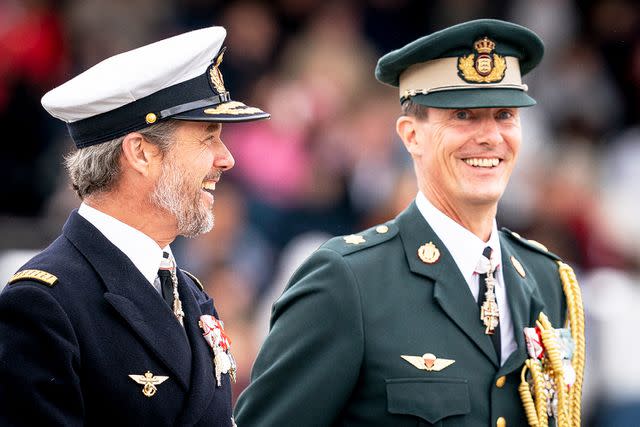 <p>Mads Claus Rasmussen/Ritzau Scanpix/AFP/Getty</p> Crown Prince Frederik of Denmark (L) and Prince Joachim of Denmark attend festivities of the Danish Army celebrating the 50th jubilee of their mother Queen Margrethe in August 2022.