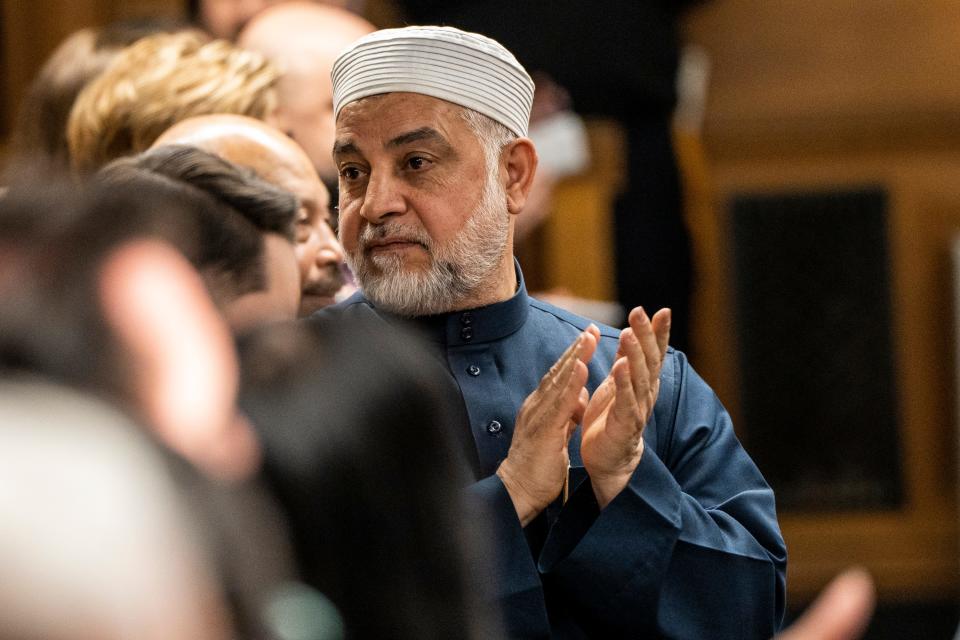 Mohammad Qatanani, Imam of the Islamic Center of Passaic County, applauds during a ceremony to swear in Nadia Kahf (not shown), as judge of the New Jersey Superior Court in Paterson on Tuesday, March 21, 2023.