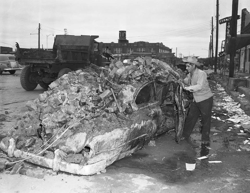 Nick Tusa, owner of Nick’s Fish Market on East Second Street in Waco, left this car seconds before a tornado struck in 1953. Power lines set fire to the car and bricks from his market crashed down on it. Tusa, who sought cover in his market, escaped from his business by pushing through debris.
