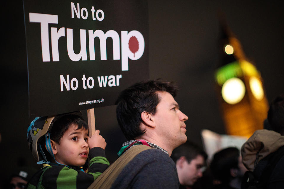 <p>A young protester holds up a placard during a rally against U.S. President Donald Trump, Feb. 20, 2017, in London. (Photo: Jack Taylor/Getty Images) </p>