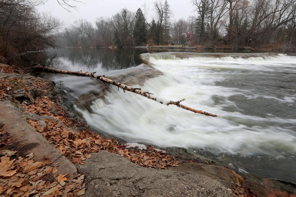 The Milwaukee River flows over the Kletzsch Park dam in Glendale