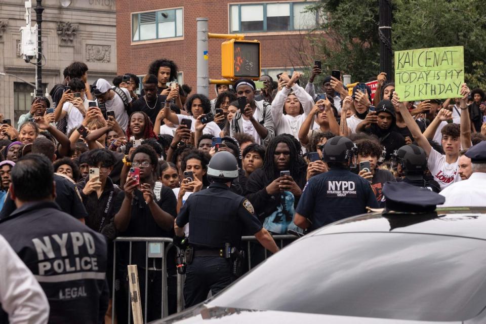 Police officers push back the crowd during the riot (AFP via Getty Images)