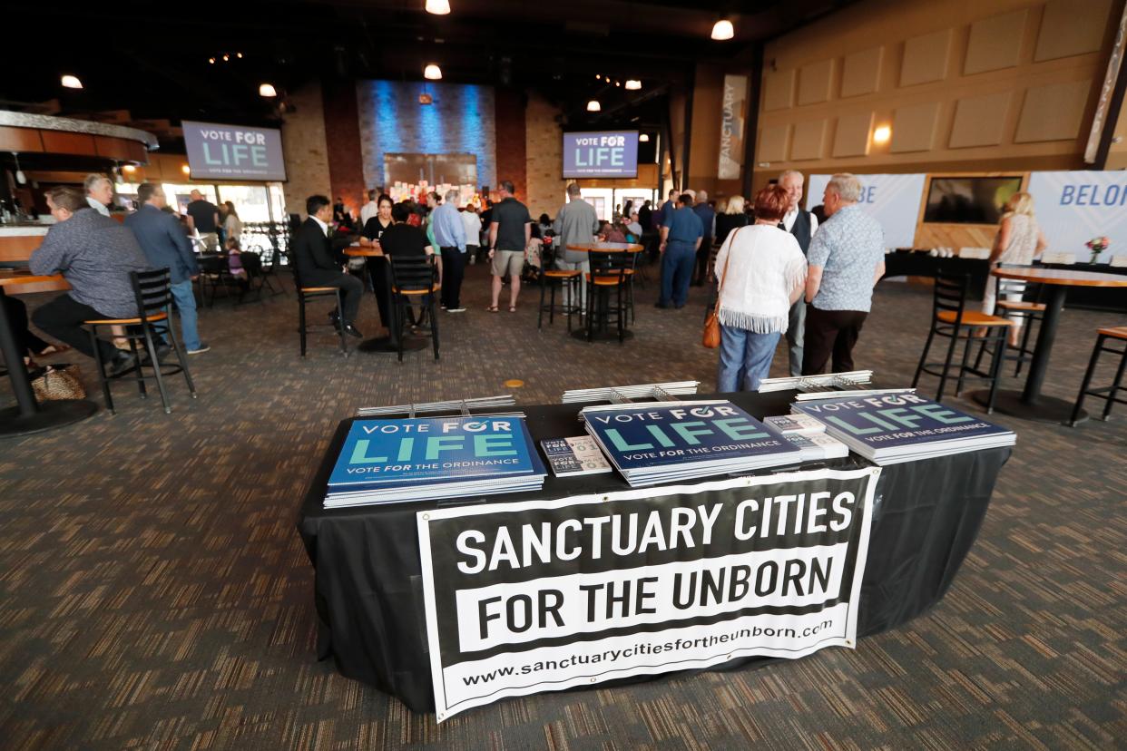 People wait for the early at an anti-abortion election watch party at Trinity Church in Lubbock, TX, Saturday May 1,2021.