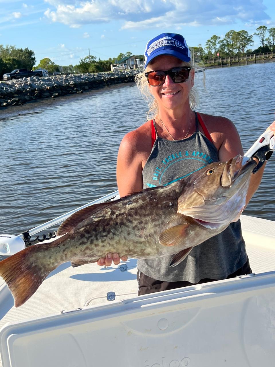 Julie Happersett holds her personal best 32” gag grouper, caught this past week while fishing 65’ of water. “Almost pulled me in” she said.