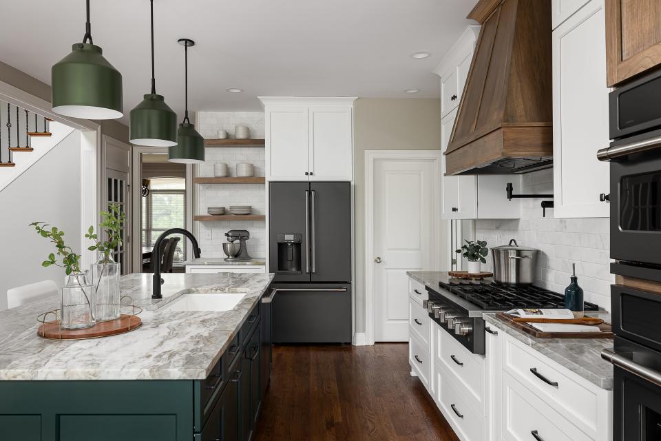 The renovated kitchen features bold colors and wood tones that the owners saw at a previous home tour.