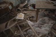 Debris lay inside a damaged apartment at a neighborhood near the scene of Tuesday's explosion that hit the seaport of Beirut, Lebanon, Friday, Aug. 7, 2020. Rescue teams were still searching the rubble of Beirut's port for bodies on Friday, nearly three days after a massive explosion sent a wave of destruction through Lebanon's capital. (AP Photo/Felipe Dana)