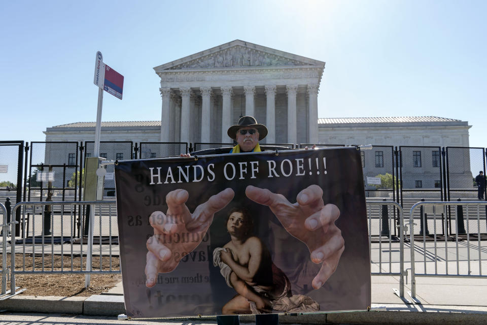 Abortion rights activist protests outside of the U.S. Supreme Court, Wednesday, May 11, 2022 in Washington. A draft opinion suggests the U.S. Supreme Court could be poised to overturn the landmark 1973 Roe v. Wade case that legalized abortion nationwide, according to a Politico report. (AP Photo/Jose Luis Magana)