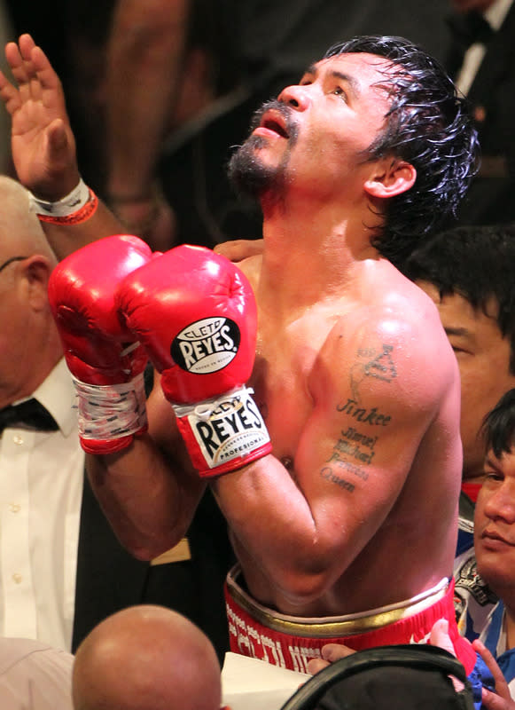 LAS VEGAS, NV - JUNE 09: Manny Pacquiao reacts after his fight against Timothy Bradley at MGM Grand Garden Arena on June 9, 2012 in Las Vegas, Nevada. (Photo by Jeff Bottari/Getty Images)