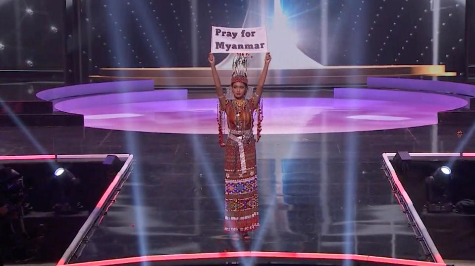 Ma Thuzar Wint Lwin, Miss Universe Myanmar, holds up the 