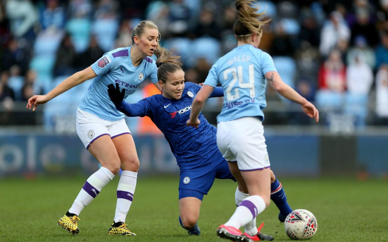 Chelsea women's Guro Reiten and Manchester City's Keira Walsh challenge during the Women's Super League - PA