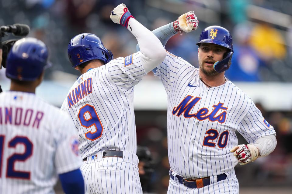 New York Mets' Pete Alonso (20) celebrates with teammatesm Brandon Nimmo (9) and Francisco Lindor (12) after hitting a two-run home run during the first inning in the first baseball game of a doubleheader against the Miami Marlins, Wednesday, Sept. 27, 2023, in New York. (AP Photo/Frank Franklin II)