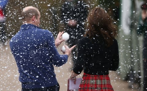 Prince William catches a fake snowball thrown by staff - Credit: PA