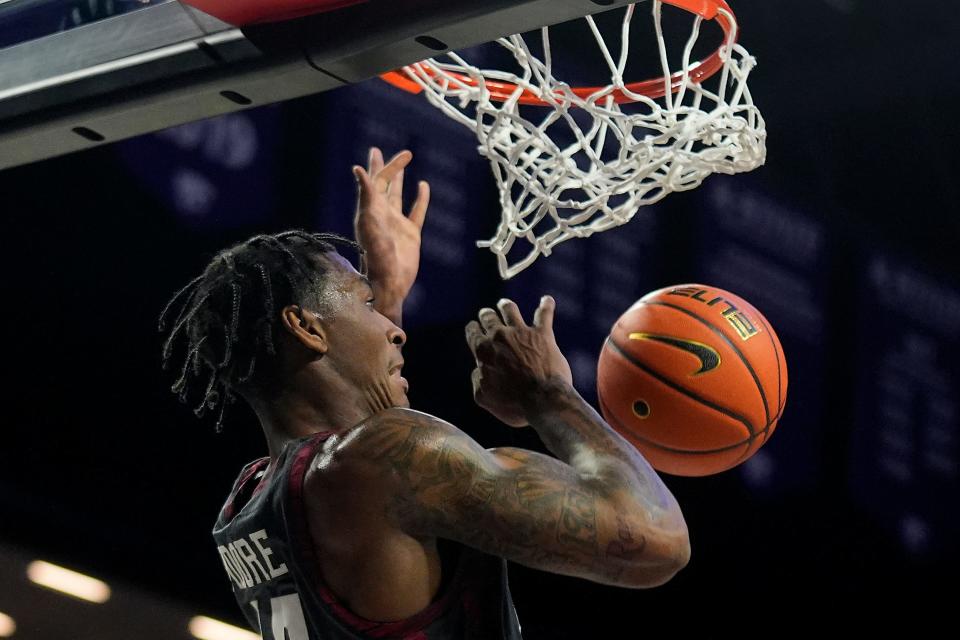 Oklahoma forward Jalon Moore dunks the ball during the first half of an NCAA college basketball game against Kansas State Tuesday, Jan. 30, 2024, in Manhattan, Kan.