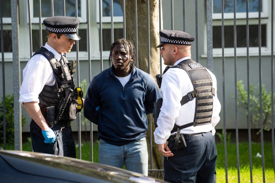 Swoop: Laudjah Dufeal is arrested by police officers after drugs were found in his Mercedes (Lucy Young)