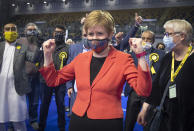 First Minister and SNP party leader Nicola Sturgeon celebrates after retaining her seat for Glasgow Southside at the count for the Scottish Parliamentary Elections in Glasgow, Scotland, Friday May 7, 2021. On winning her seat in Glasgow, Nicola Sturgeon, said early results indicated that her party was on course to win its fourth straight election in Scotland but that the final outcome would not emerge until Saturday evening. (Jane Barlow/PA via AP)