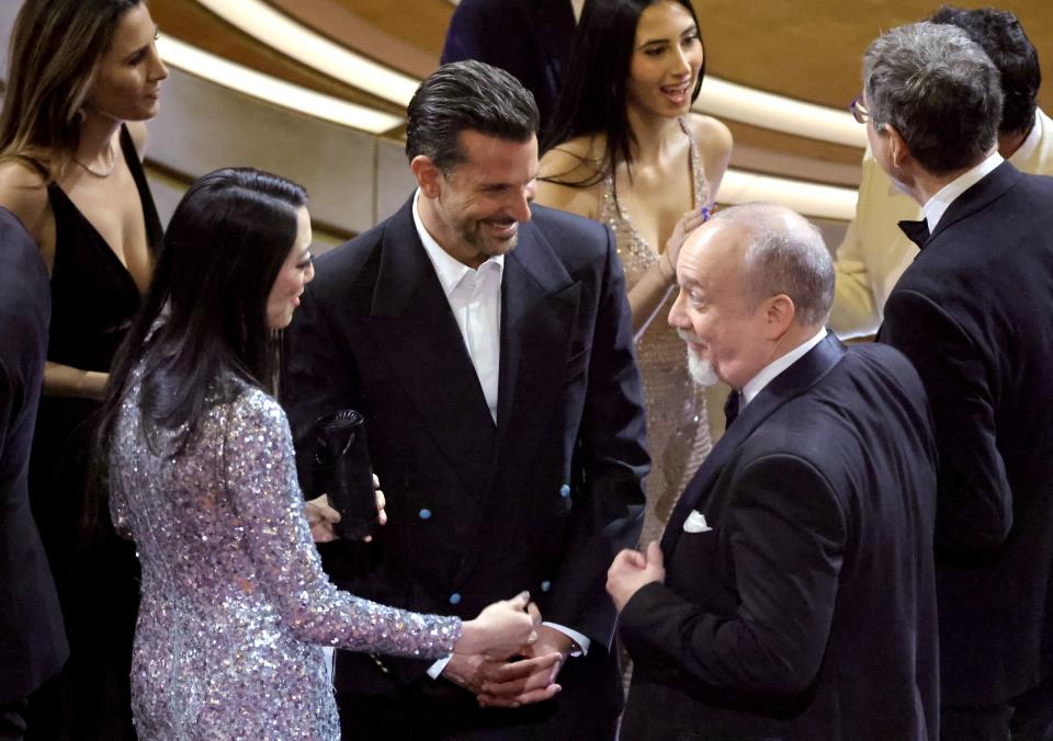 Clara Wong, Bradley Cooper, and Paul Giamatti in the audience during the 96th Annual Academy Awards at Dolby Theatre on March 10, 2024