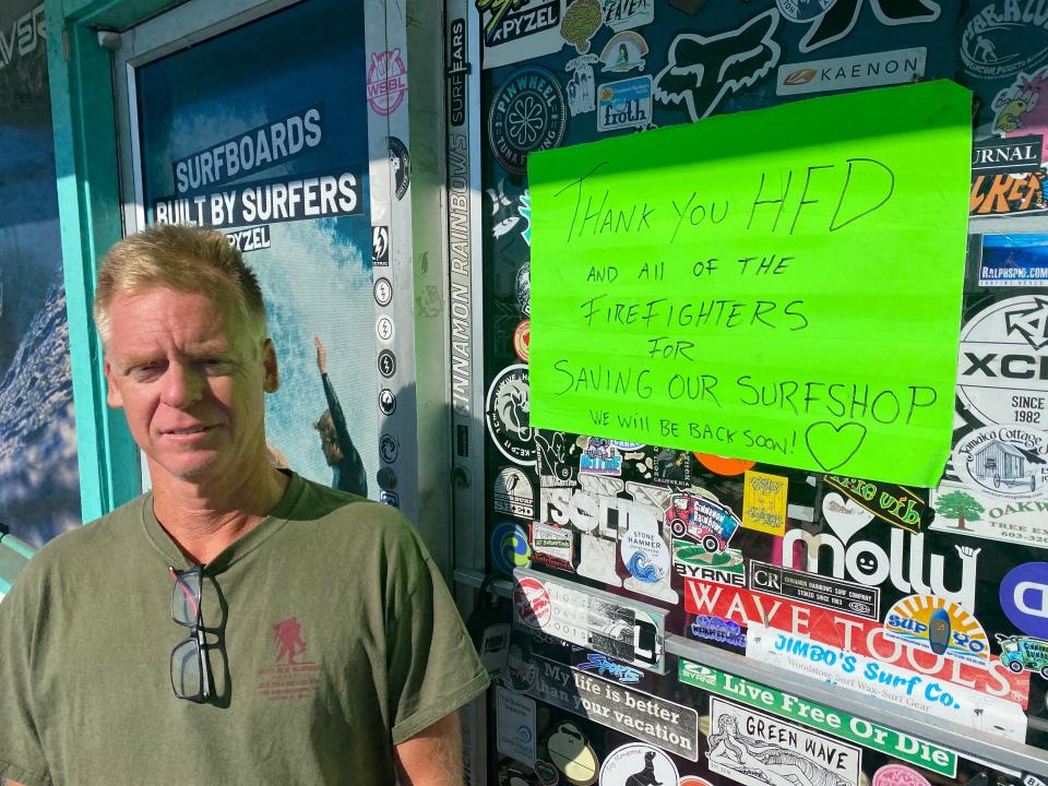 Cinnamon Rainbows Surf Co. owner Dave Cropper outside his shop where a fire caused smoke damage Aug. 19. The fire did not enter the surf shop, but flames badly damaged its neighbors in the plaza - Secret Spot and North Beach Bar and Grill.