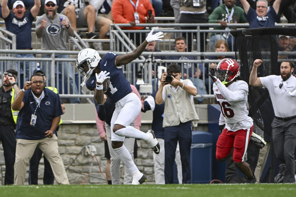 Penn State wide receiver KeAndre Lambert-Smith (1) scores a touchdown in front of Indiana defensive back Jordan Grier (16) during the second half of an NCAA college football game, Saturday, Oct. 28, 2023, in State College, Pa. (AP Photo/Barry Reeger)