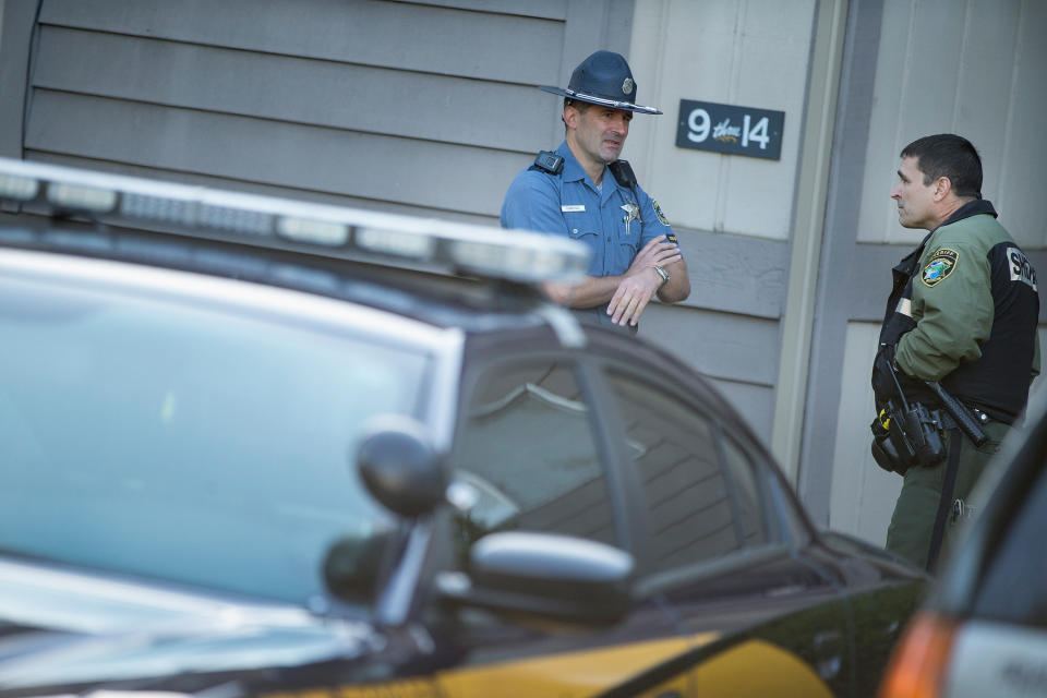 Police stand watch outside the apartment where 26-year-old Chris Harper Mercer lived on October 2, 2015 in Winchester, Oregon. Yesterday Mercer went on a shooting rampage at Umpqua Community College, killing nine people and wounding another seven before he was killed. After Mercer's death police found six guns and a flak jacket at the school and another seven guns in his home.&nbsp;
