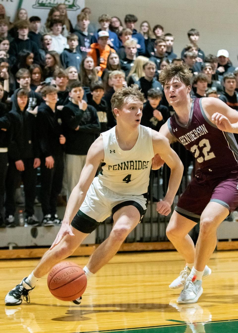 Pennridge's Matt Campione dribbles past West Chester Henderson's Danny Suroweic during the Rams' 66-52 District One 6A first-round playoff loss.