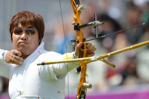 South Korea's Im Dong-Hyun competes during a men's individual archery elimination round at the London Olympics on July 30. South Korea's peerless archers, included the legally blind Im, hit the bull's-eye with three out of four gold medals