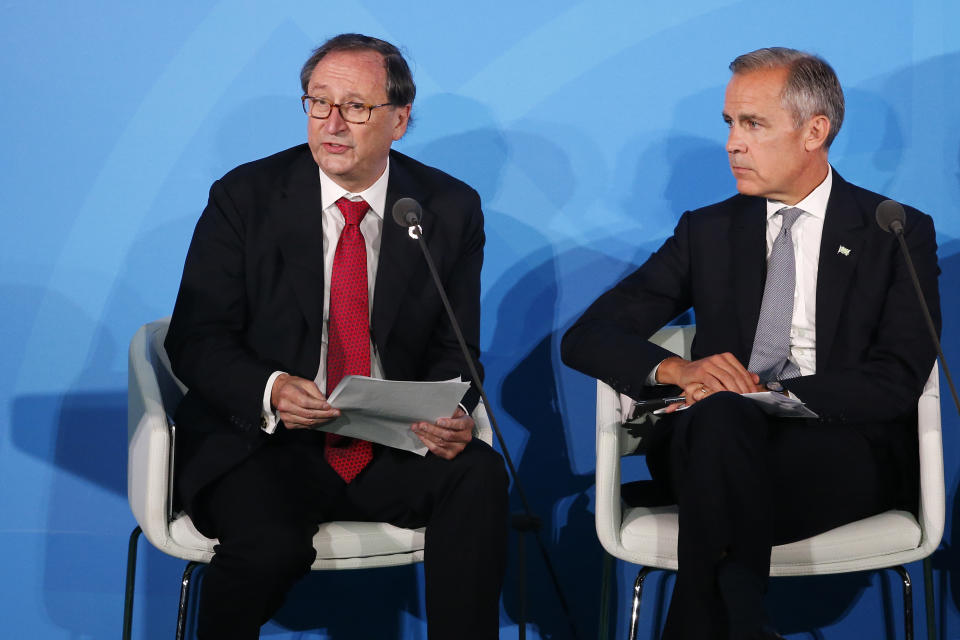Willis Towers Watson Chief Executive Officer John Haley, left, is joined by Bank of England Governor Mark Carney as he addresses the Climate Action Summit in the United Nations General Assembly, at U.N. headquarters, Monday, Sept. 23, 2019. (AP Photo/Jason DeCrow)