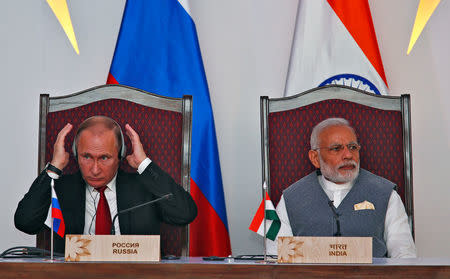 India's Prime Minister Narendra Modi (R) and Russian President Vladimir Putin attend an exchange of agreements event after the India-Russia Annual Summit in Benaulim, in the western state of Goa, India, October 15, 2016. REUTERS/Danish Siddiqui