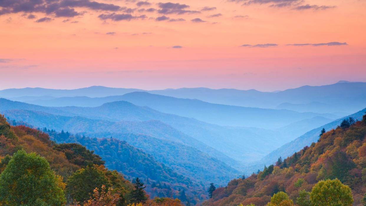 rolling mountain ranges at sunrise