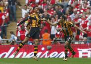 Hull City's Curtis Davies (L) celebrates with team mate Ahmed Elmohamdy after scoring his team's second goal against Arsenal during their FA Cup final soccer match at Wembley Stadium in London, May 17, 2014. REUTERS/Eddie Keogh (BRITAIN - Tags: SPORT SOCCER)