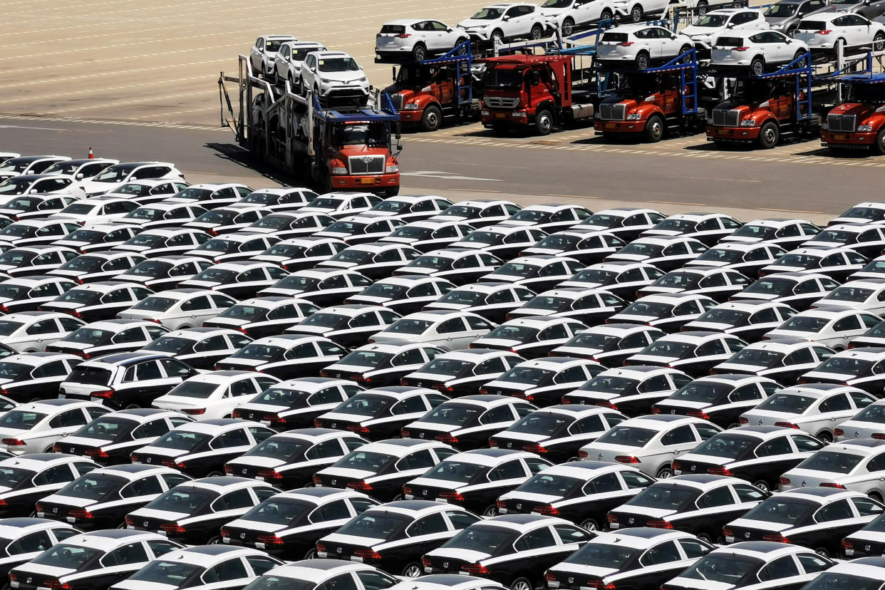 A carrier trailer transports newly manufactured cars at a port in Dalian, Liaoning province, China May 21, 2019. Picture taken May 21, 2019. REUTERS/Stringer ATTENTION EDITORS - THIS IMAGE WAS PROVIDED BY A THIRD PARTY. CHINA OUT.