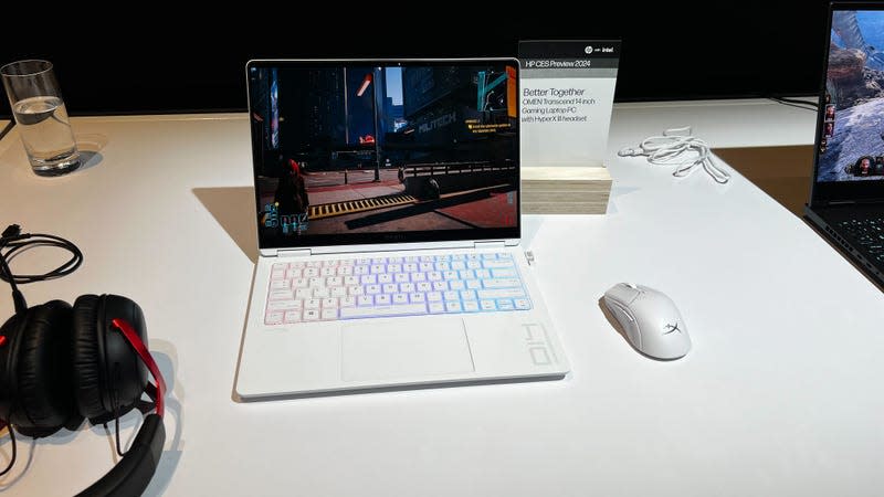 HP Transcend Laptop on a white table. 